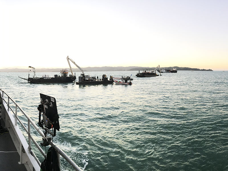 RPAS monitoring station on a vessel deck overlooking barges and a crane at sea